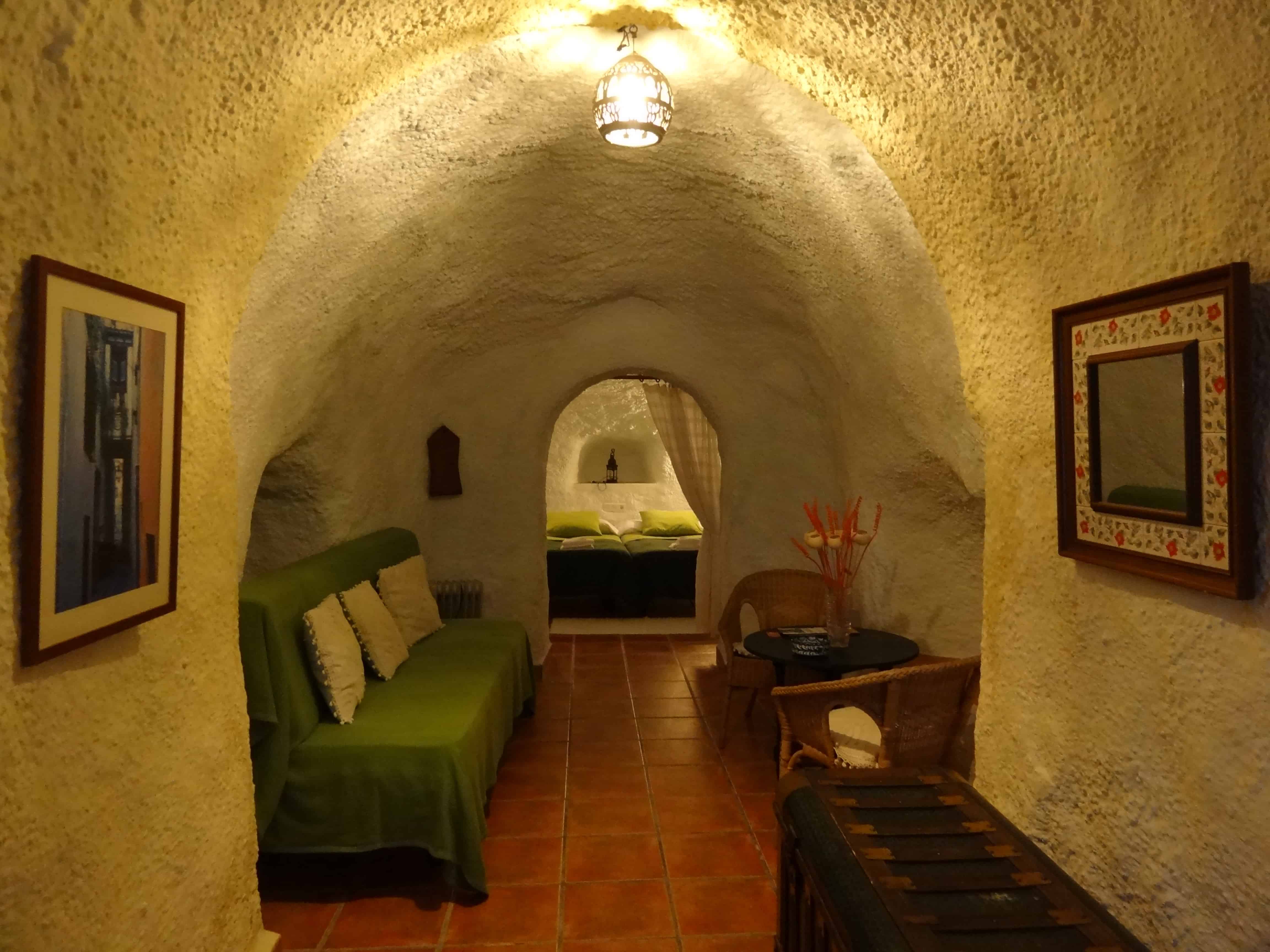 Staying at a cosy cave hotel in Granada.