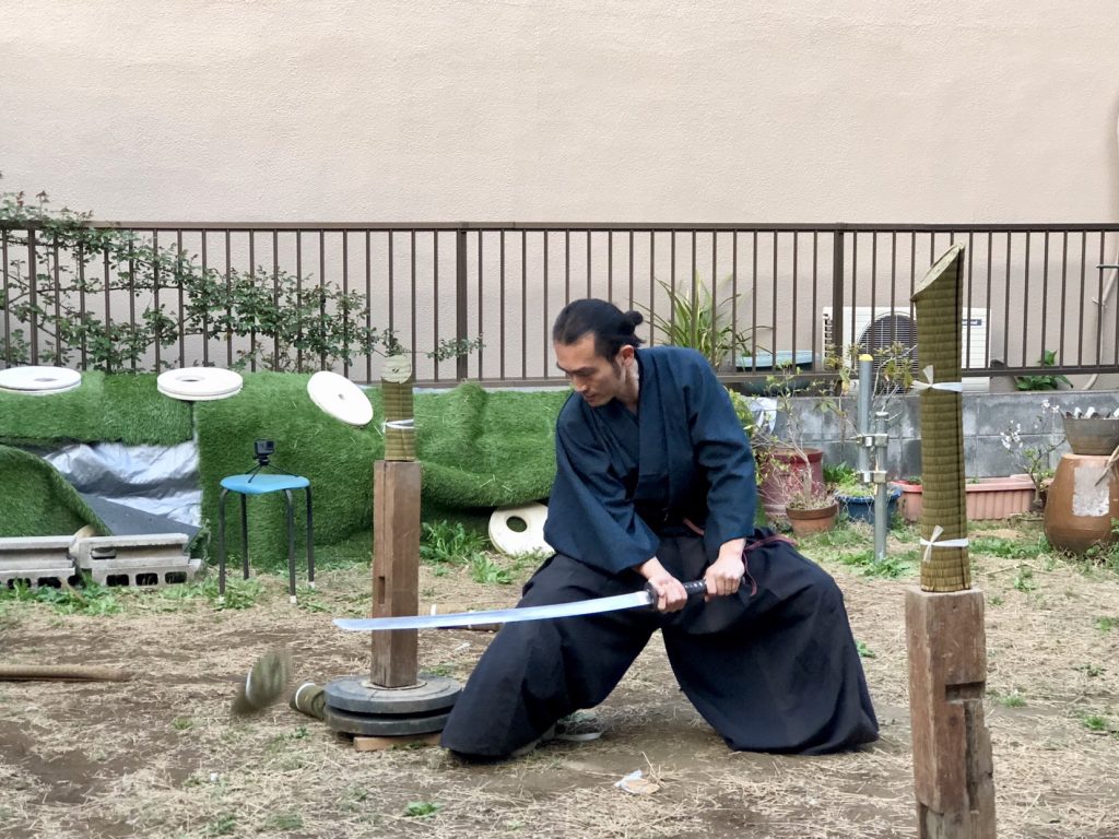 samurai holding a wazikashi sword and practicing