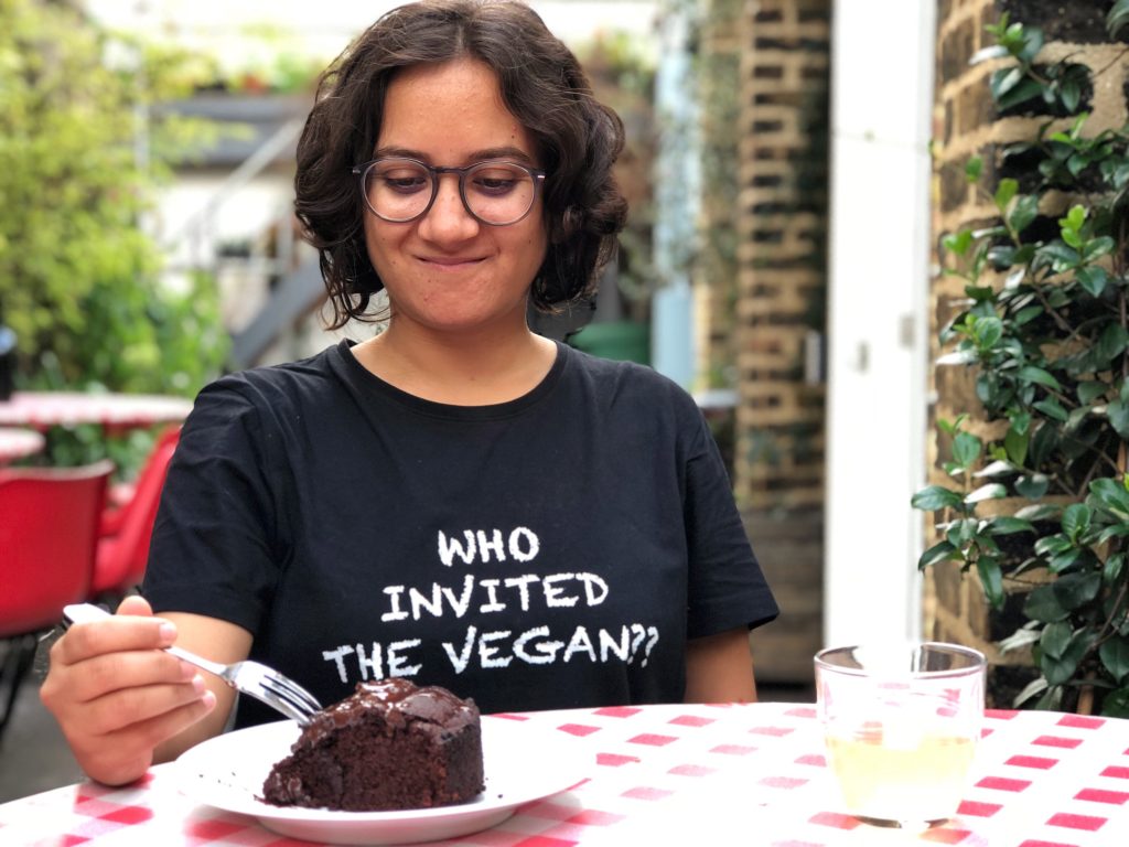 traveler trying the vegan cake in london